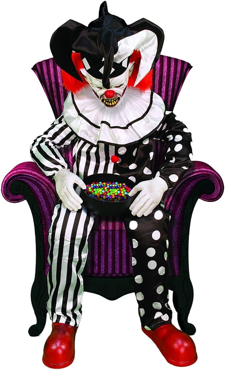 Sitting Scare Clown animatronic asleep in a chair holding a candy bowl